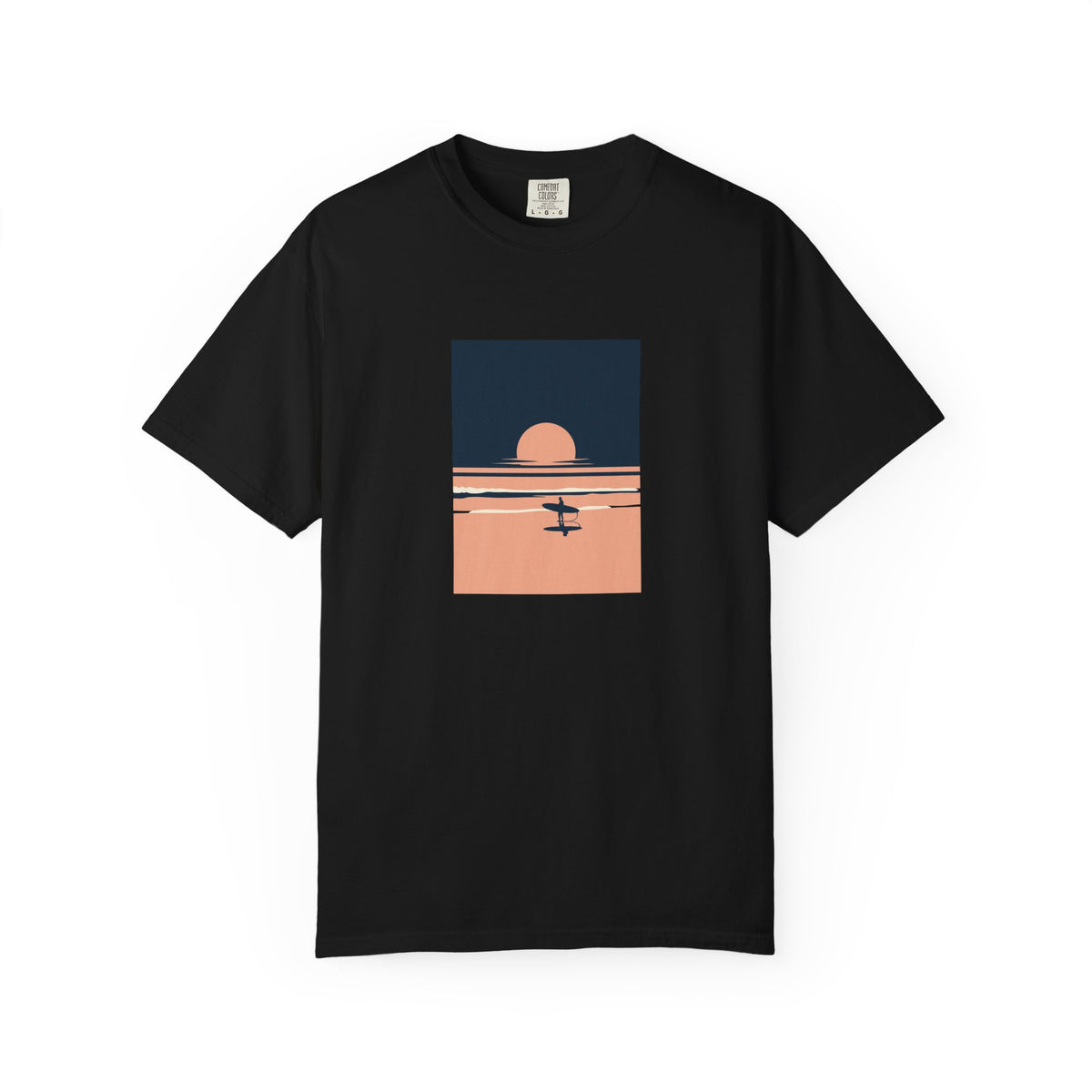Black T-shirt with a blue and peach sunset illustration with waves and a surfer holding a board printed on the front.
