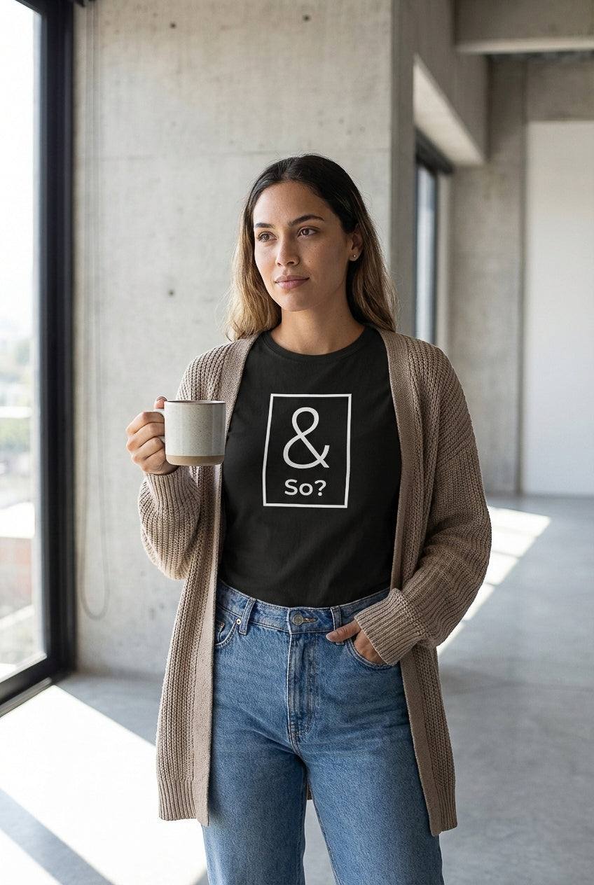 Model wearing the black & So? graphic T-shirt indoors