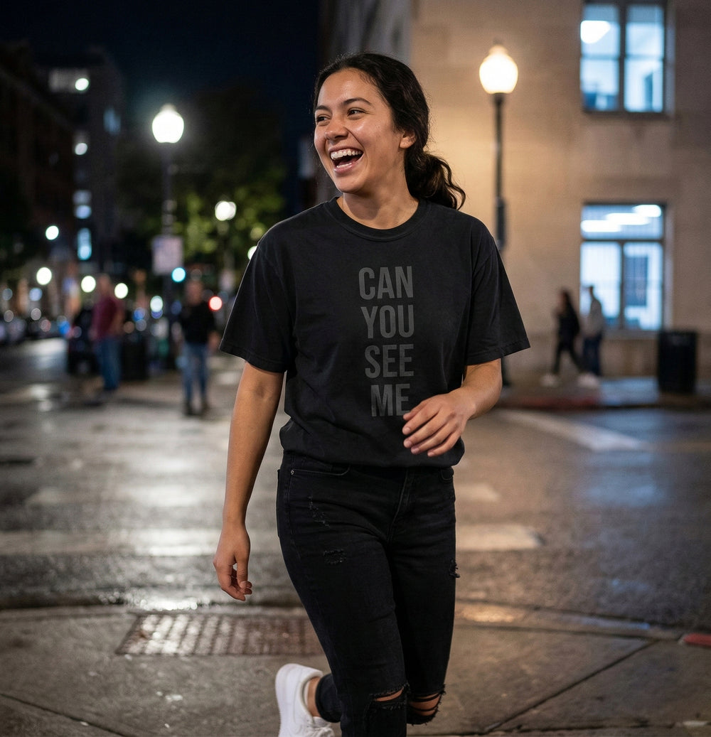 Model wearing a Blacksunset T-shirt with the "Can You See Me" design, lifestyle view 2